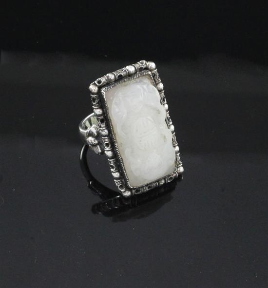 A Chinese silver mounted white jade ring, early 20th century, total width 3.1cm